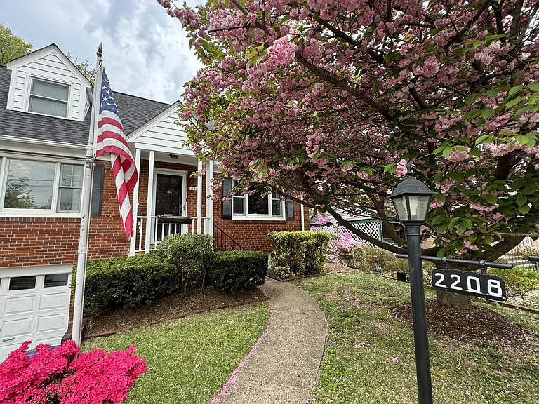 The house in spring, with the Japanese Cherry tree in bloom.