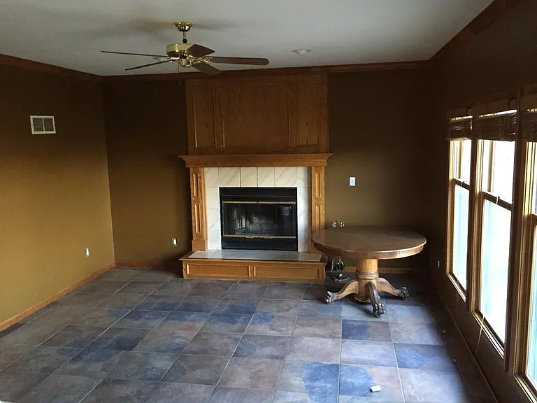 Tiled living room - one step down, with wood burning fire pl