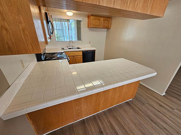 Kitchen features LOTS of storage, new microwave and dishwasher