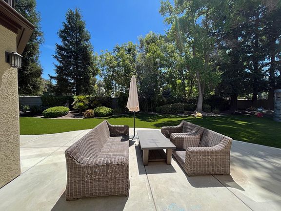 Backyard patio furniture included. Artificial turf installed in back.