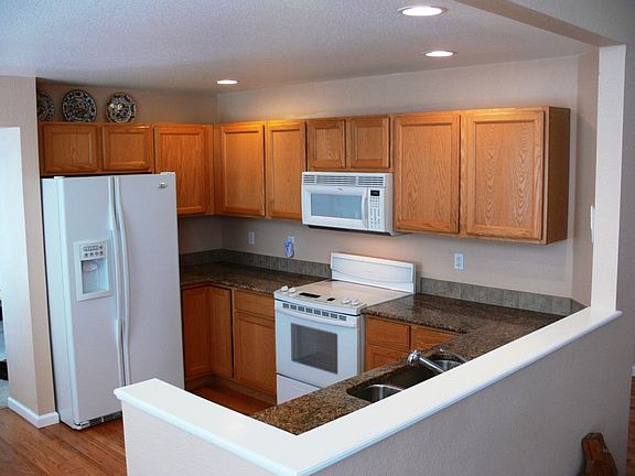 She'll love the large eat-in kitchen with buffett and GRANITE C-TOPS