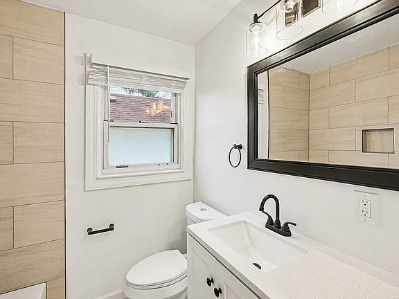 Updated bathroom with new vanity and toilet, tiled shower/tub area, tiled floor, new blinds and more!