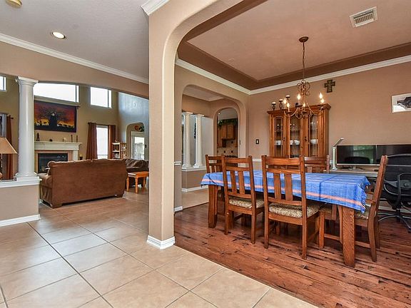 Wide Open! Perfect for entertaining! Hand scraped wood flooring in Dining Room. Tray Ceiling!