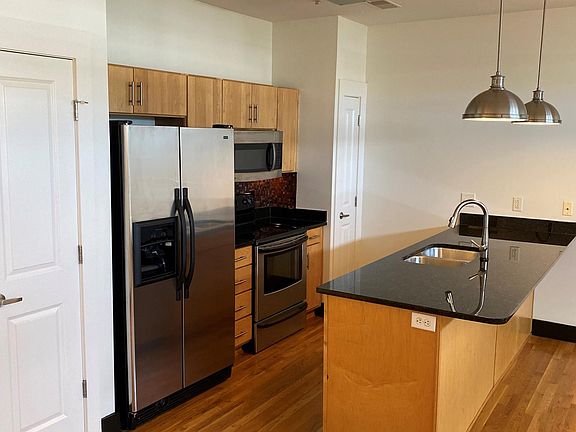 Full Kitchen including Refrigerator, Dishwasher, Microwave, Oven, and two pantry closets.