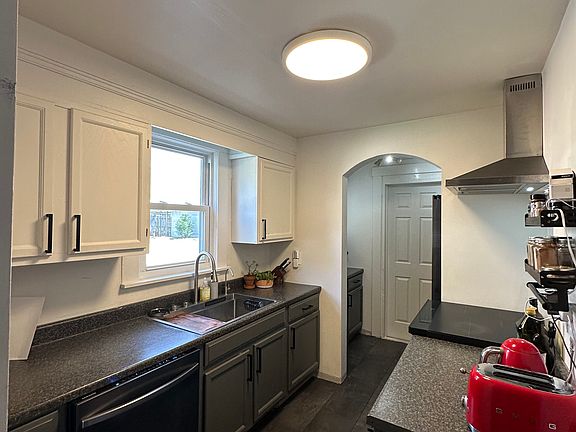 Kitchen _ Appliances included: dishwasher, oven, and fridge; microwave is located in the pantry. Other items shown are for display only; unit is rented unfurnished.