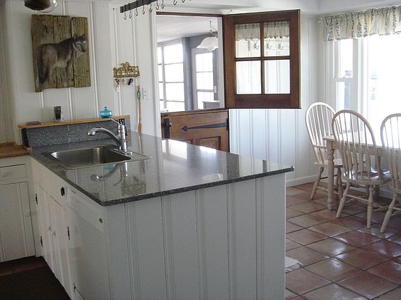 Updated Eat-in Kitchen has Newer Appliances and Mexican Tile Floor