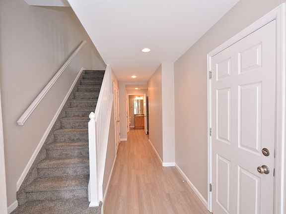 Entry into home with garage access thru door on the right.