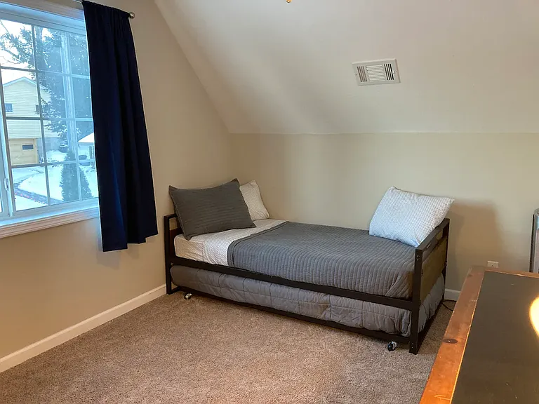 Bedroom 2. home does not come furnished. furnishing is for visual reference only.