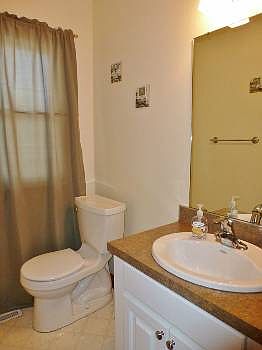 Right behind the kitchen is this half bathroom.