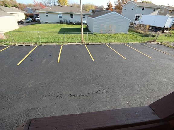 Fenced parking lot in rear