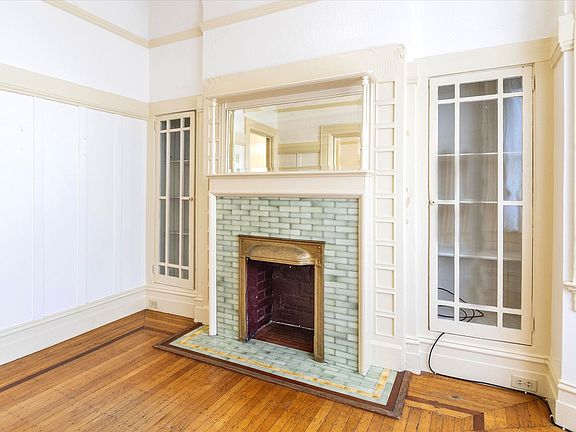 Beautiful original built-ins surround fireplace