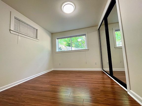 Bedroom w/ view to greenway