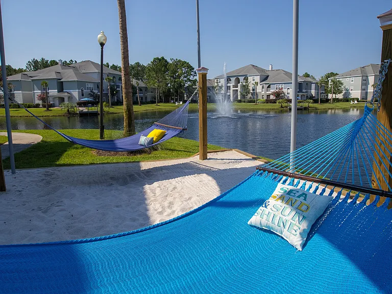 Relax in our lakeside hammock lounge. Close your eyes, sway in the breeze, and let worries drift away in our serene oasis.