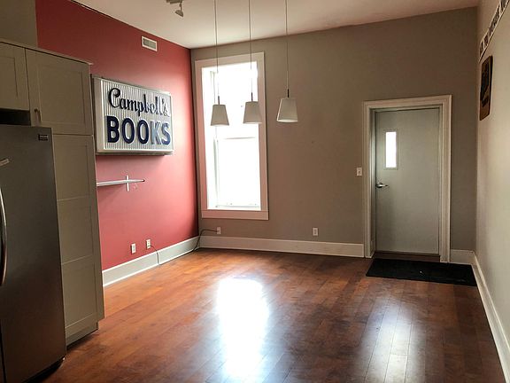 Dining area with south-facing window and door to back deck.