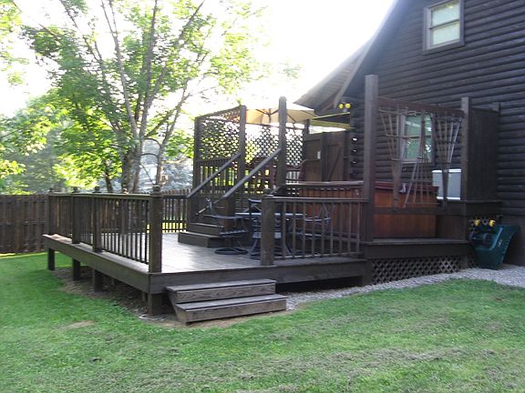 Rear, multilevel deck with hot tub