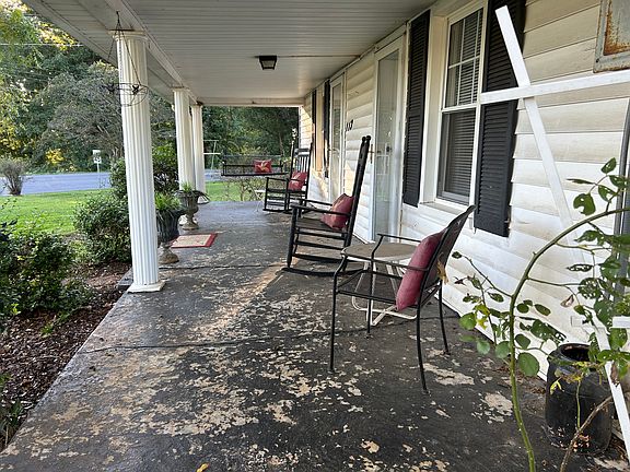 Front porch with swing and rocking chairs