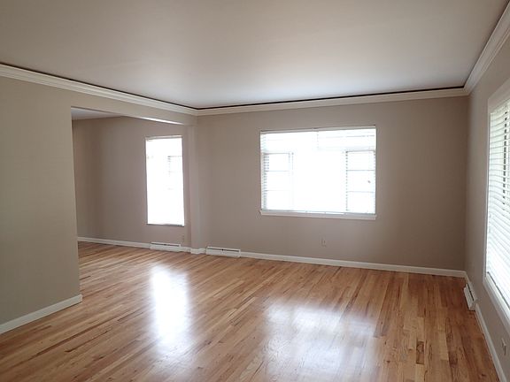 Large living room with lots of south facing windows