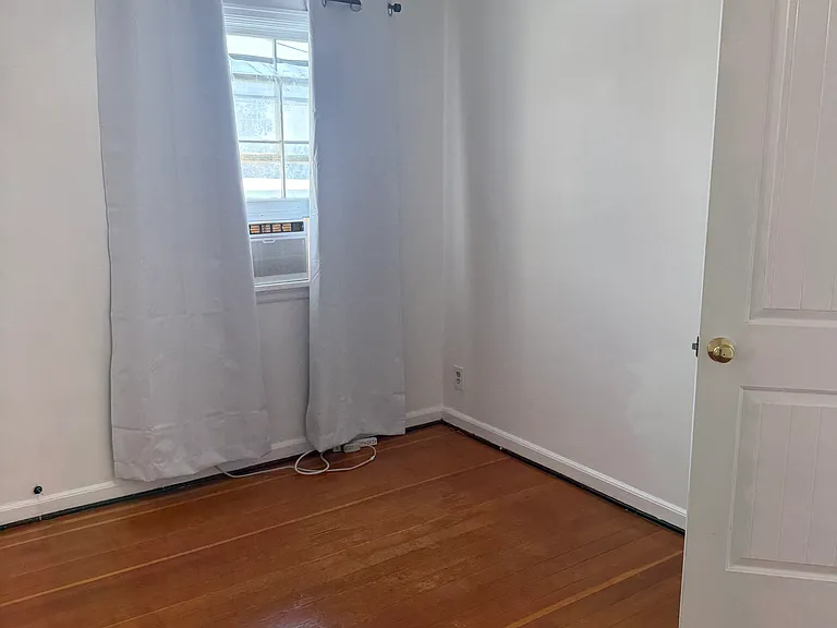 Bedroom with fan and views