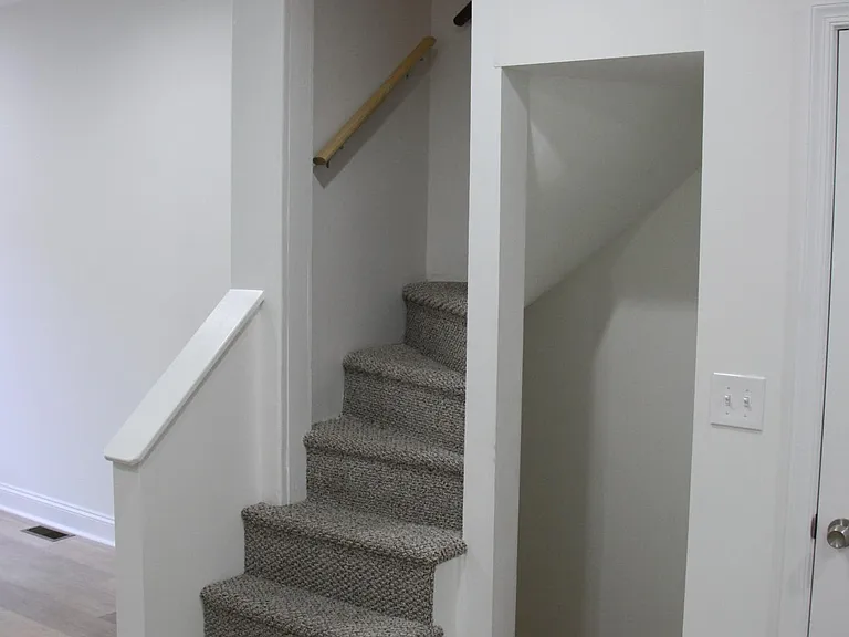 Trinity stairs up to 2nd Floor and down to Basement/Man Cave.
