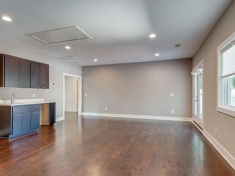 Media space on 2nd level has a bar sink, a separate powder room and door leading to the outside deck.