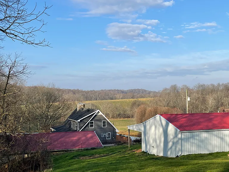 View from upper lot, which has a barn. Below that is the four-car garage and the house