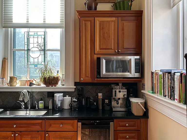 Beautiful natural light. Another look at the wine cooler and microwave.
