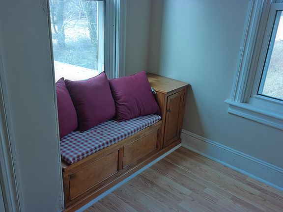Private sitting area with library shelves.