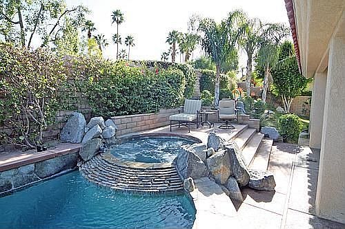 Close up of the spa, with stacked rock spillway
