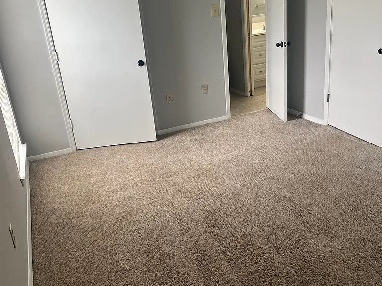 Master bedroom with direct access to in-unit laundry room and master bath