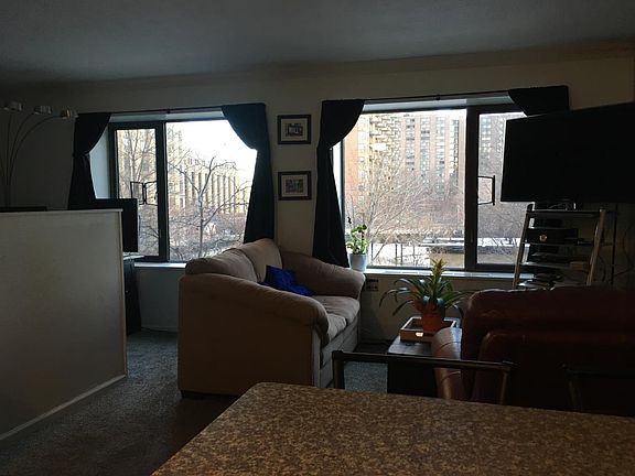 Living room and entry way to sleeping area from the kitchen.
