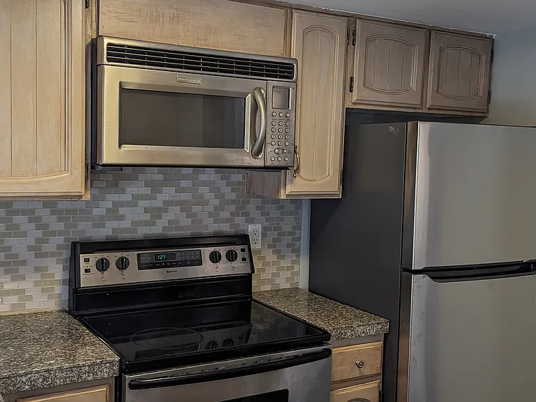 Flat Top Range, Microwave, Dishwasher and Refrigerator included