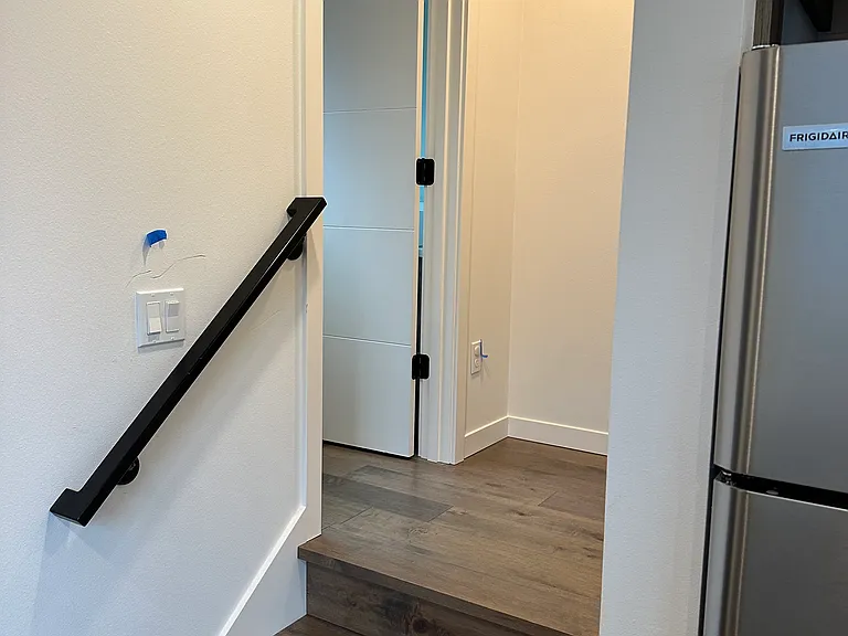 Short stairway to bath room off kitchen.