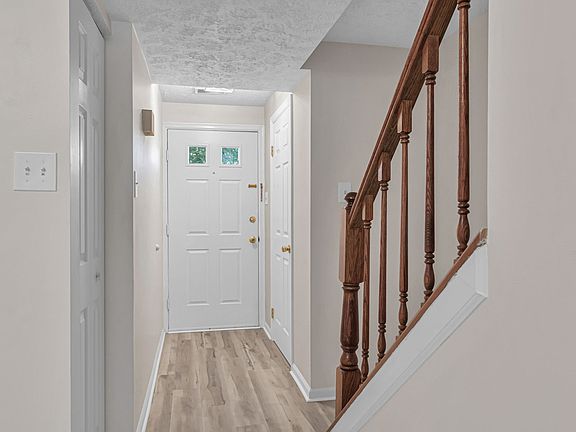 Foyer with bathroom and coat closet