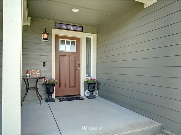 Inviting front entry is covered.