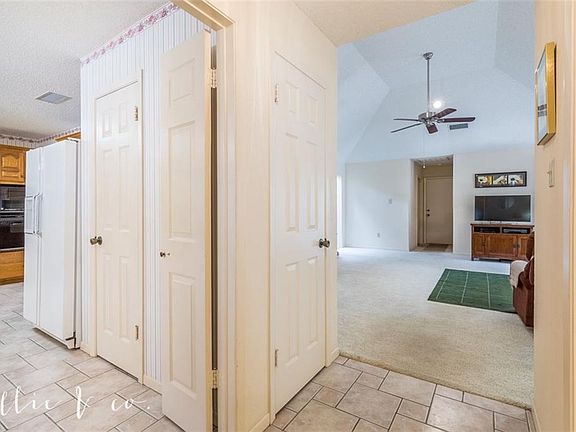 From front door, enter the home with easy access to kitchen on the left and living area straight ahead.