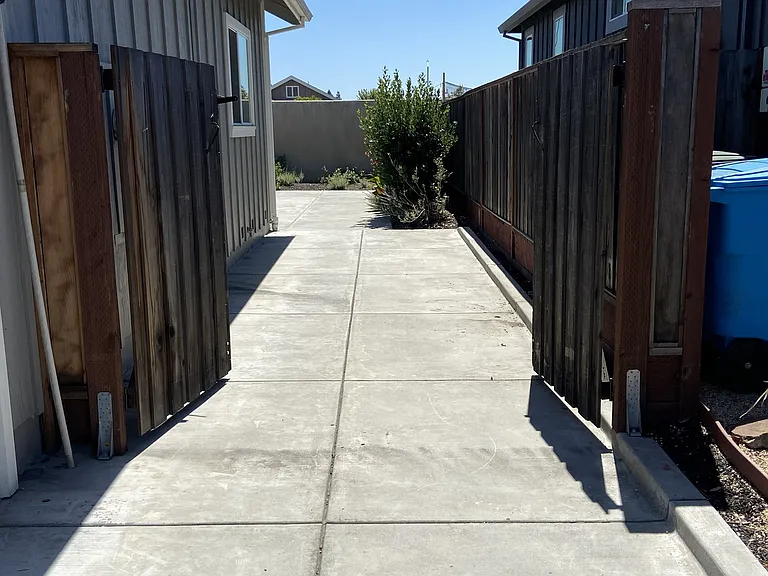Fenced-in area for a small boat with a double swinging gate.