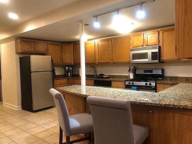 Chef's kitchen with breakfast counter