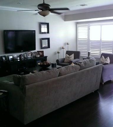Living room with tile floors that look exactly like real wood.