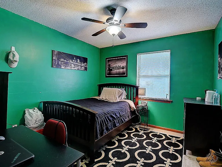 Bedroom. The room is painted to a more neutral color
