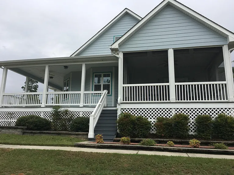 Side of house with screened in porch