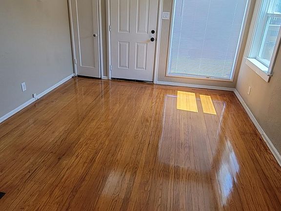 Living room----new flooring, windows and blinds