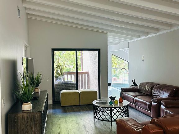 living room facing entrance stairs