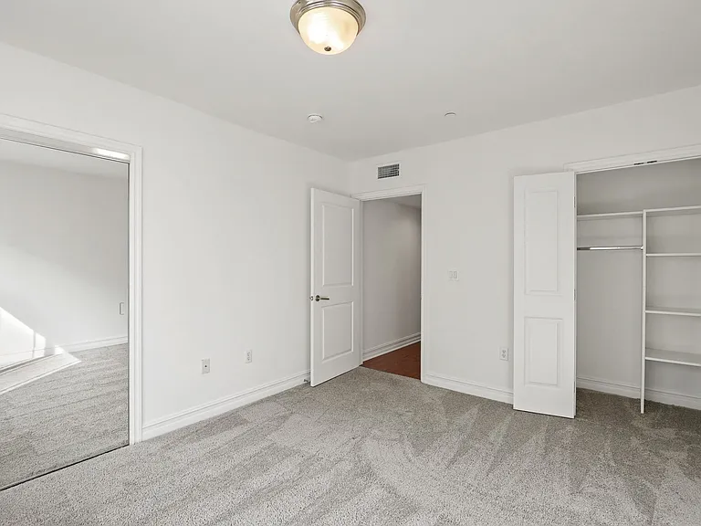 Bedroom with Double Closets with Built-In Organizers