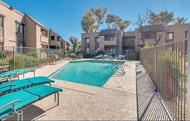 Smaller pool located outside of condo, Larger pool is front of complex
