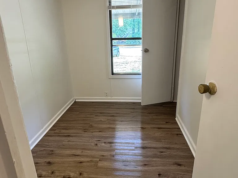 First bedroom, small with closet.