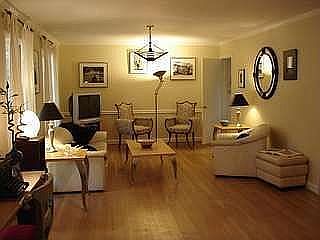 Enormous open great room with hardwood floors and room for baby grand