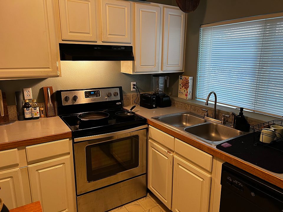 Kitchen with stove, dishwasher, fridge