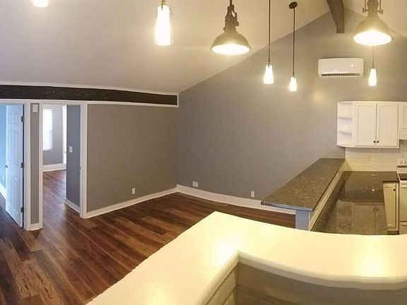 Panoramic View of Living and Kitchen from Laundry