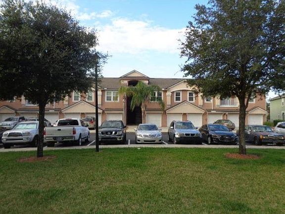View of the condo building from the dog walk and play area directly across from the condo.