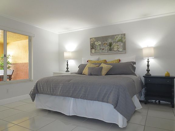 Master bedroom has a king size bed and a desk to work from home.